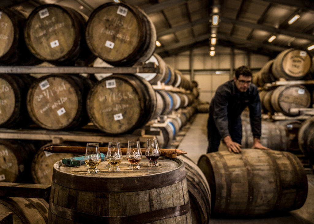 Cask samples in the dunnage warehouse and rolling a barrel