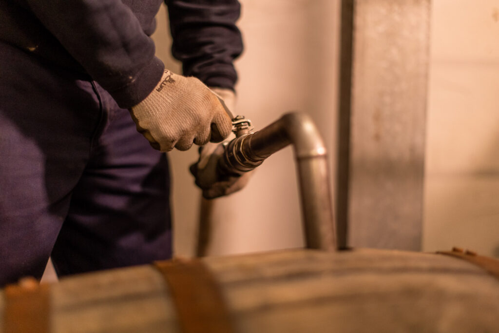 Filling a cask with new spirit at Kilchoman distillery