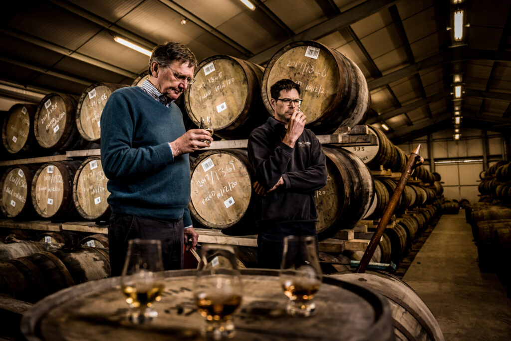 Sampling casks in the dunnage warehouse at Kilchoman distillery