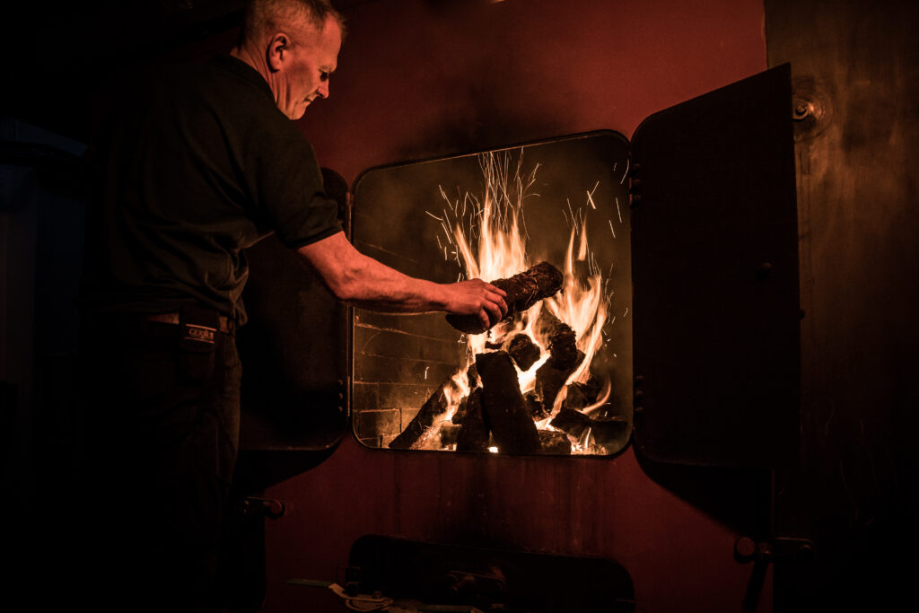 Kilchoman kiln fire burning peat smoking the barley